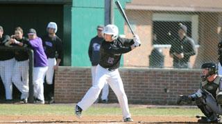 Baseball player getting ready to swing the bat at home plate