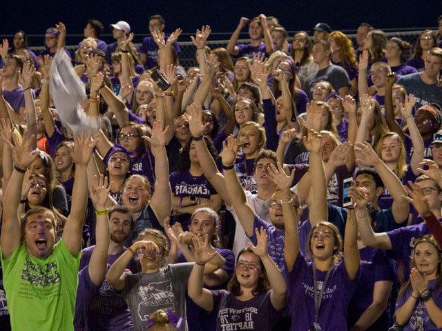 SBU students cheering at football game